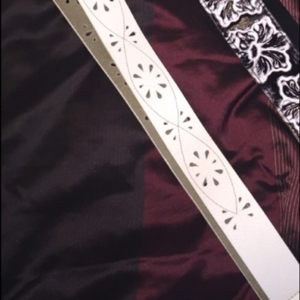 One replacement guitar/purse strap and a belt